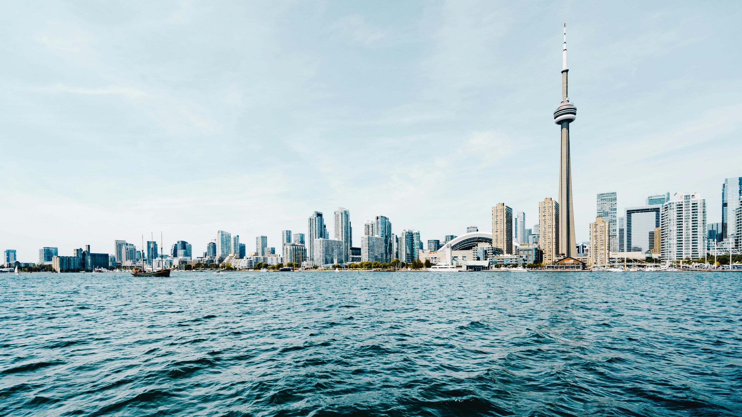 Beautiful daytime view of Toronto's skyline with CN Tower and waterfront.
